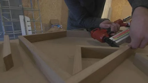 Carpenter using tools to create detailed wall piece Stock Footage 139449260