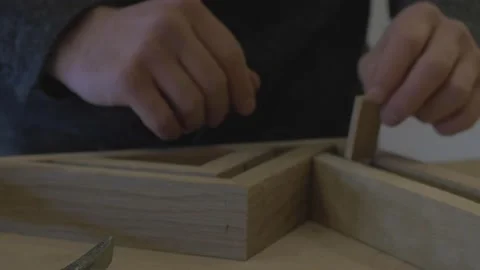 Carpenter using tools to create detailed wall piece Stock Footage 139449264