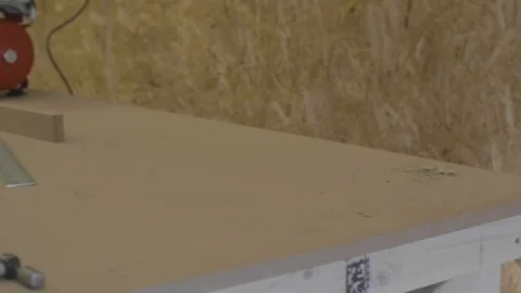 Carpenter using tools to create detailed wall piece Stock Footage 139449267