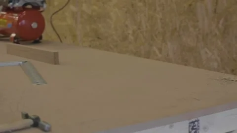 Carpenter using tools to create detailed wall piece Stock Footage 139449271