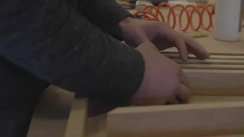 Carpenter using tools to create detailed wall piece Stock Footage 139449275