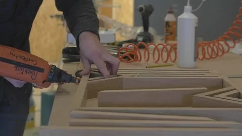 Carpenter using tools to create detailed wall piece Stock Footage 139449279