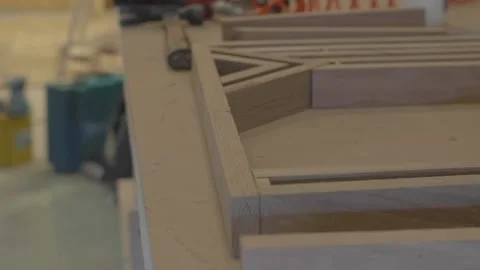 Carpenter using tools to create detailed wall piece Stock Footage 139449290