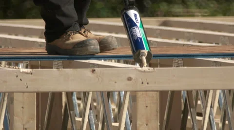 Carpenter Using Wood Glue for New Home Construction. 動画素材 67453877