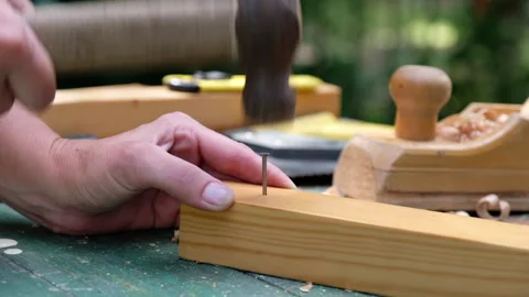 Carpenter woman using a hammer to hitting a nail Stock Footage 136035984
