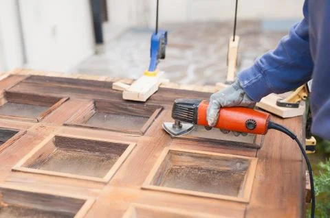 Carpenter at work with angular Sander. Stock-Fotos