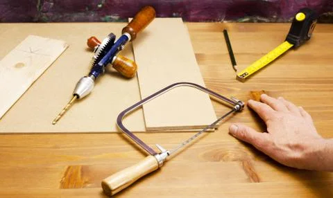 Carpenter at work bench with his tools Stock Photos