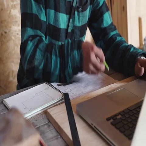 Carpenter work in his workshop with drawing equipment, paper, ruler, pencil and Stock Footage 69531934