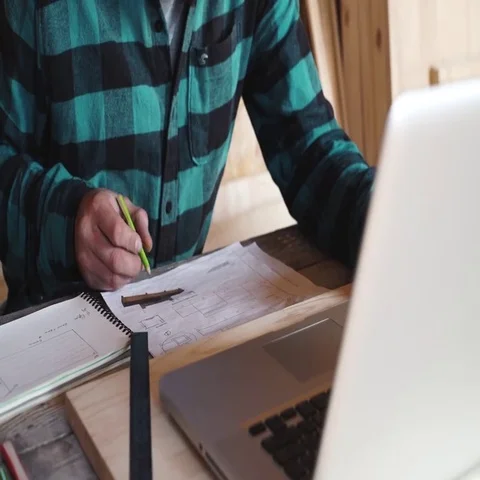 Carpenter work in his workshop with drawing equipment, paper, ruler, pencil and Stock Footage 69532001