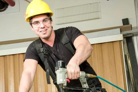 Carpenter at work on job using power tool Stock-Fotos