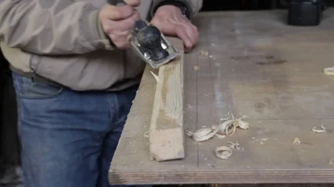 Carpenter work with plane on wood plank Stock Footage 73168637