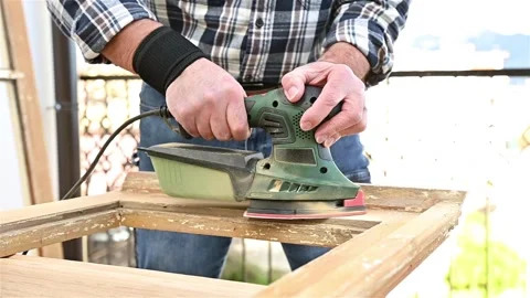 Carpenter at work, restoring an old wooden window. Carpentry. Stock Footage 325994298