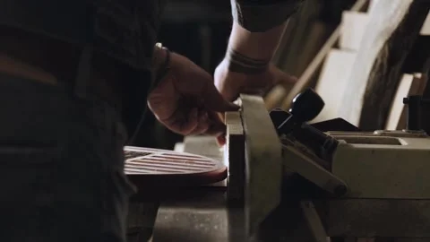 Carpenter work with wood joiner planer.Worker processing wood using machine tool Stock Footage 166337115