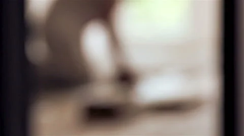 Carpenter worker installing glue for wood parquet board during flooring Stock Footage 40874127