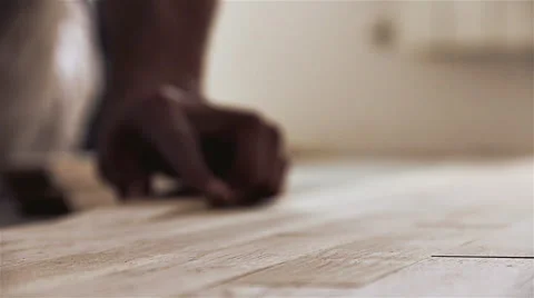 Carpenter worker installing parquet Stock Footage 40869878