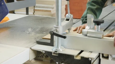 Carpenter worker operating wood cutting machine Stock Footage 106800747