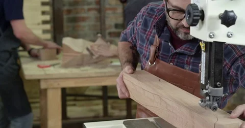 Carpenter Working on an Band-Saw Stock Footage 84906900