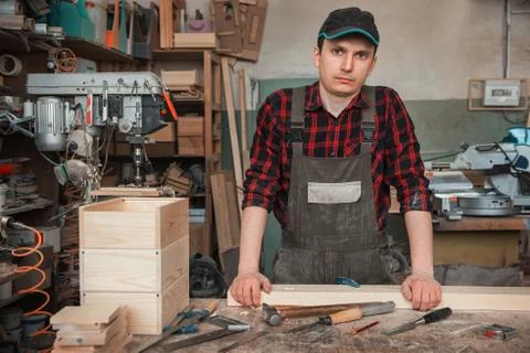 Carpenter working with a chisel Stock Photos