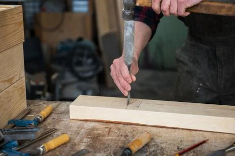 Carpenter working with a chisel Stock Photos