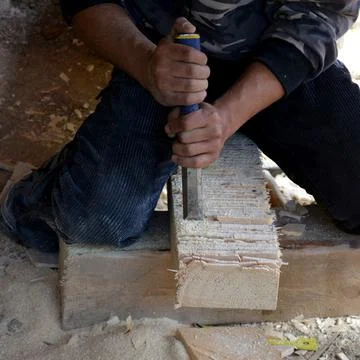 Carpenter working with a chisel Stock Photos