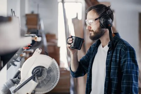 Carpenter working with circular saw Stock Photos