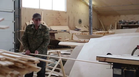 Carpenter working with circular saw woodworking machine Stock Footage 59781214