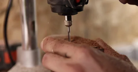 Carpenter working on the drill machine in his workshop Video stock 233578711