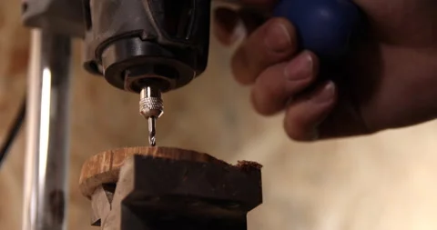 Carpenter working on the drill machine in his workshop Video stock 233580819