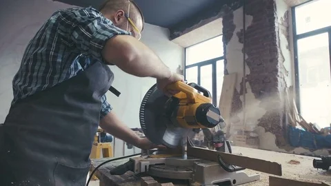 Carpenter working with an electric jigsaw. Workshop of the joiner Stock-Footage 72729090