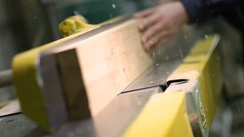 Carpenter working with electric planer on plank Video stock 73303037