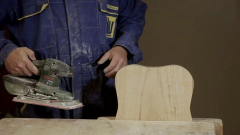 Carpenter working with electric Sander in the studio Stock Footage 100783928
