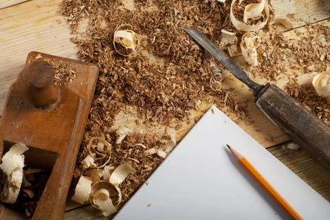 Carpenter working, hammer, meter and screw-driver on construction background. Stock Photos