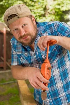 Carpenter working by hand drill Stock Photos