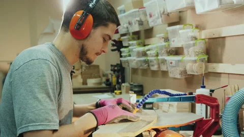 Carpenter working with jigsaw machine cuts out the detail Stock Footage 144266135