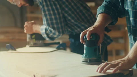 Carpenter Working With a LatheAnother Carpenter Working Electric Sanding Machine Stock Footage 236465391