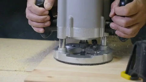 Carpenter working of manual milling machine in the carpentry workshop. slow Stock Footage 88470773