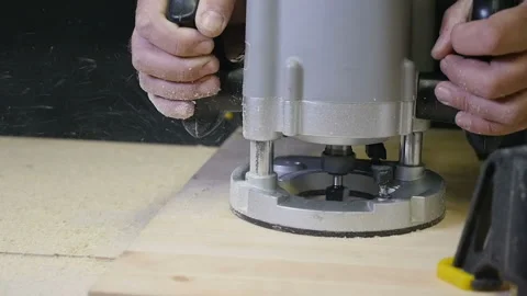 Carpenter working of manual milling machine in the carpentry workshop. slow Stock Footage 88471543