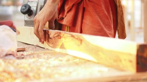 A carpenter is working using an electric planer Stock Footage 139186565