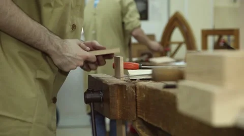 Carpenter working on wood with a chisel, slider shot Stock Footage 64119644