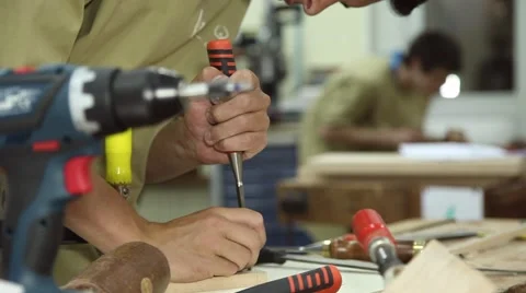 Carpenter working wood with a chisel, slider shot Stock Footage 64119848