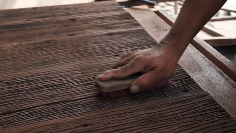 Carpenter Working with Wood in his Workshop, Polishing Ols Plank Wood. Closeu Stock Footage 104245596