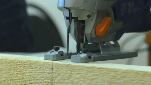 Carpenter working with wood using electric grinder. 4k close up Video stock 77623741