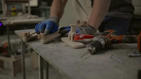 Carpenter working on woodworking machines in carpentry shop. Stock Footage 219346908