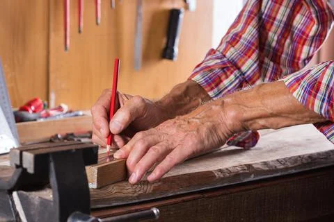 Carpenter working on the work bench, joinery tools and woodwork Stock Photos