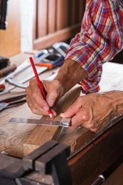 Carpenter working on the work bench, joinery tools and woodwork Stock Photos
