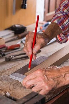 Carpenter working on the work bench, joinery tools and woodwork Stock Photos