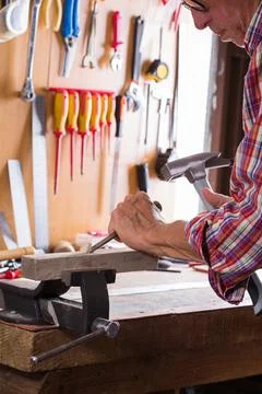 Carpenter working on the work bench, joinery tools and woodwork Stock Photos