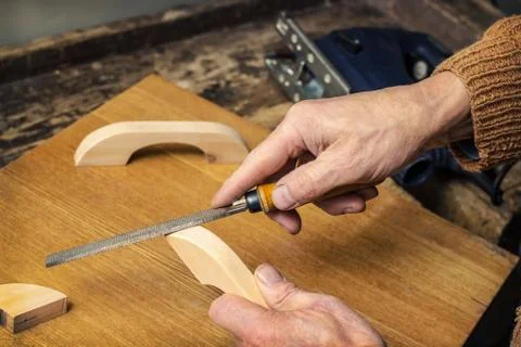Carpenter working in a workshop rasp Stock-Fotos