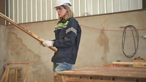 A carpenter works in a carpentry workshop. Stock Footage 253887572