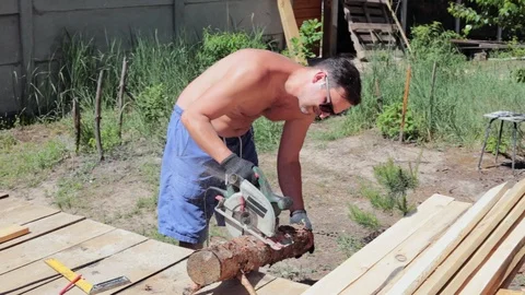 The carpenter works with the circular saw. Stock Footage 90288121